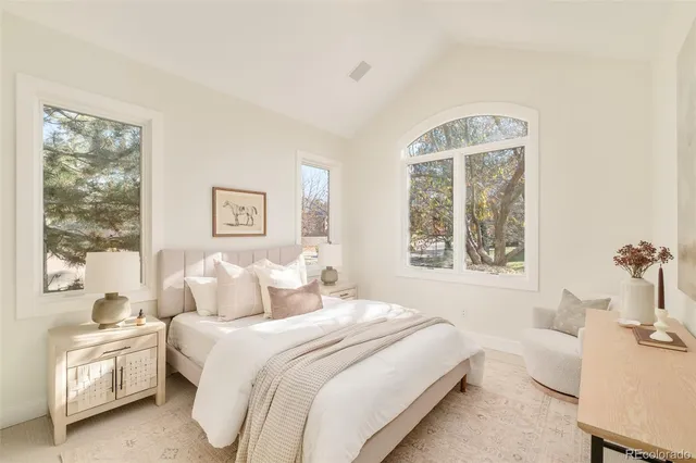 a sign of golf club on a wall under a tree