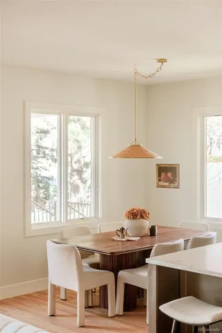 a living room with kitchen island furniture and a kitchen view