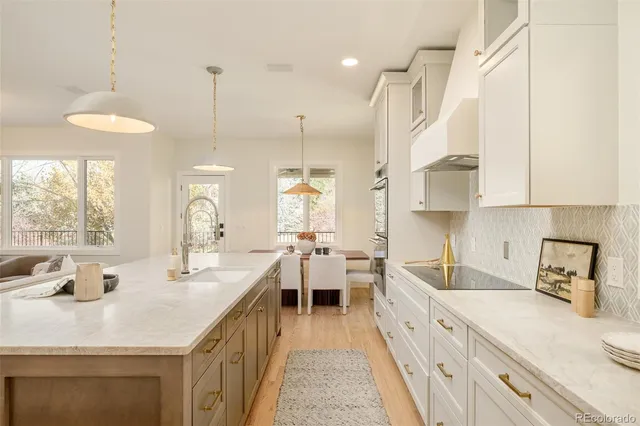 a view of a dining room with furniture and a large window
