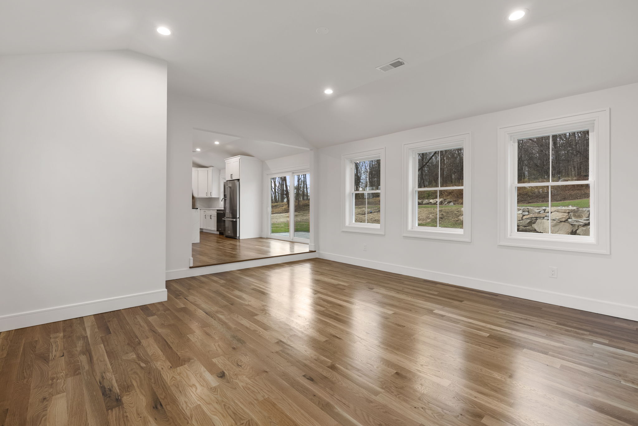52 Curtis Road Bridgewater, CT 06752 - Photo 11 of 25 a view of an empty room with wooden floor and a window