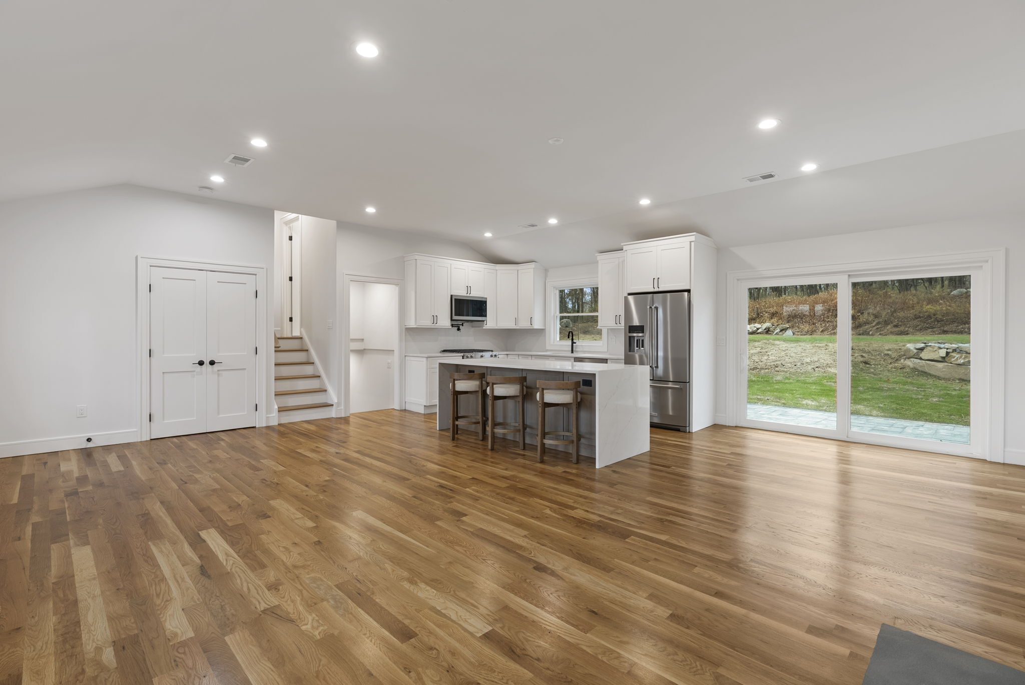 52 Curtis Road Bridgewater, CT 06752 - Photo 5 of 25 a view of kitchen with stainless steel appliances refrigerator oven and chairs