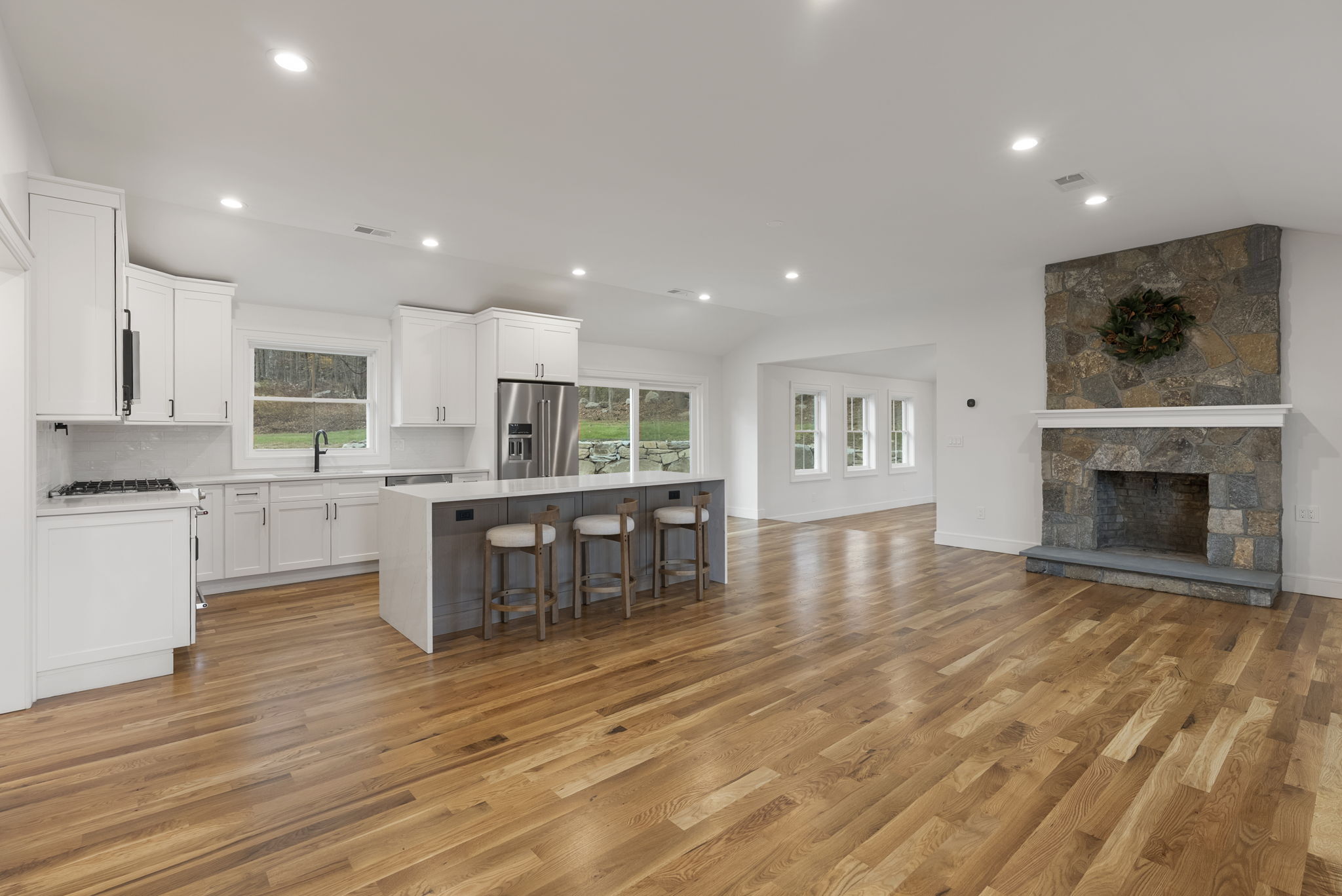 52 Curtis Road Bridgewater, CT 06752 - Photo 7 of 25 a living room with stainless steel appliances furniture or kitchen view and a living room view