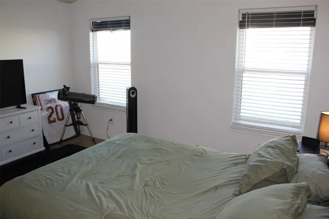 a bedroom with a bed and television