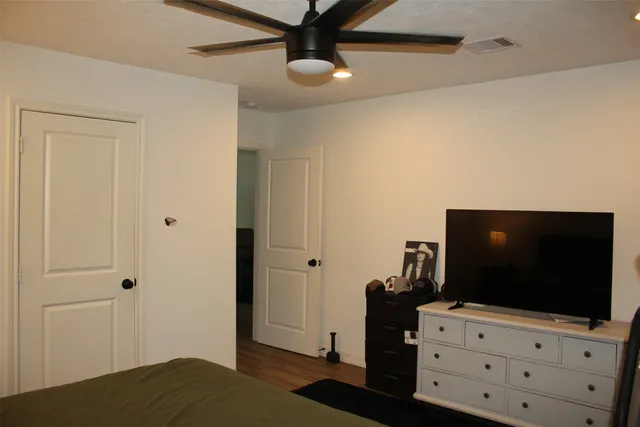 a bathroom with a sink and mirror with toilet