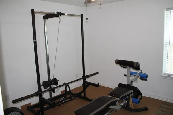 a view of a storage and utility room with washer and dryer