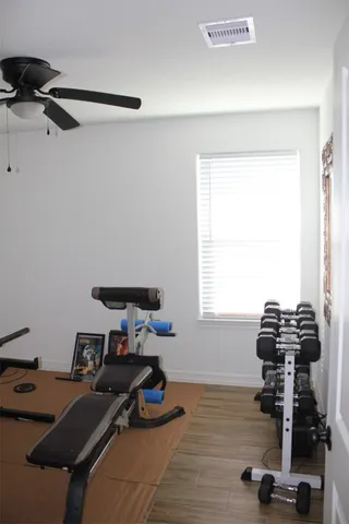 a view of workspace with wooden floor windows