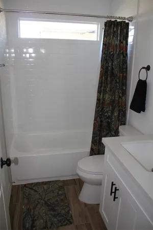 a view of a house with a garden and yard