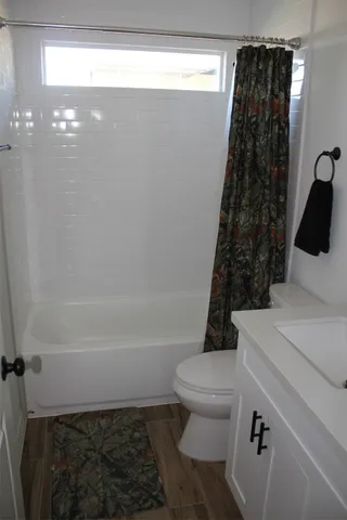 a house view with swimming pool in front of it