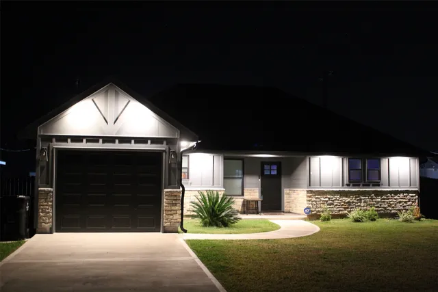 a front view of a house with a yard
