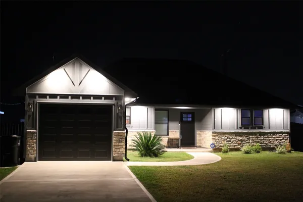 a bathroom with a sink and mirror with toilet