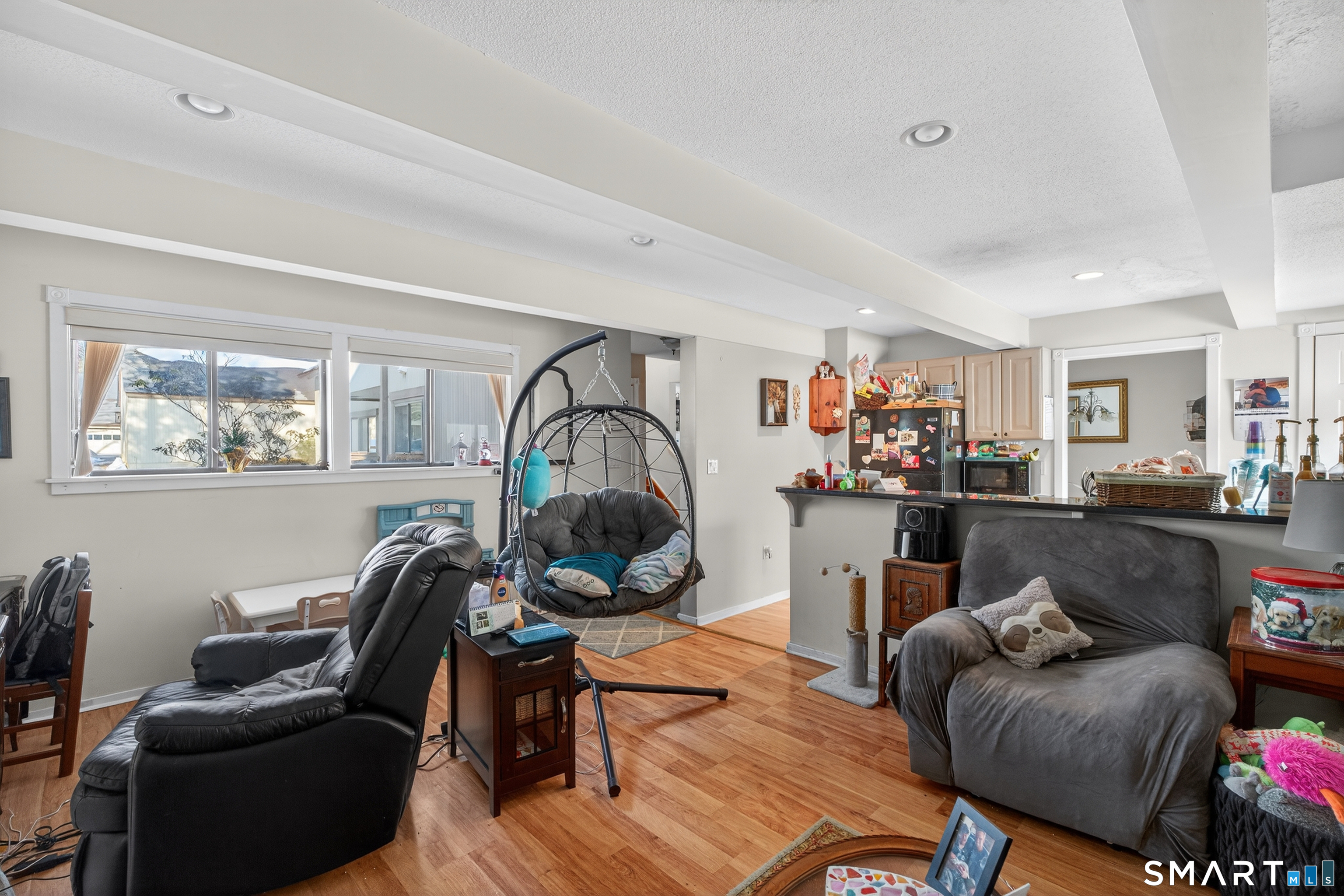 9 Upper Commons, Unit 9 Woodbury, CT 06798 - Photo 11 of 38 a living room with furniture and a wooden floor