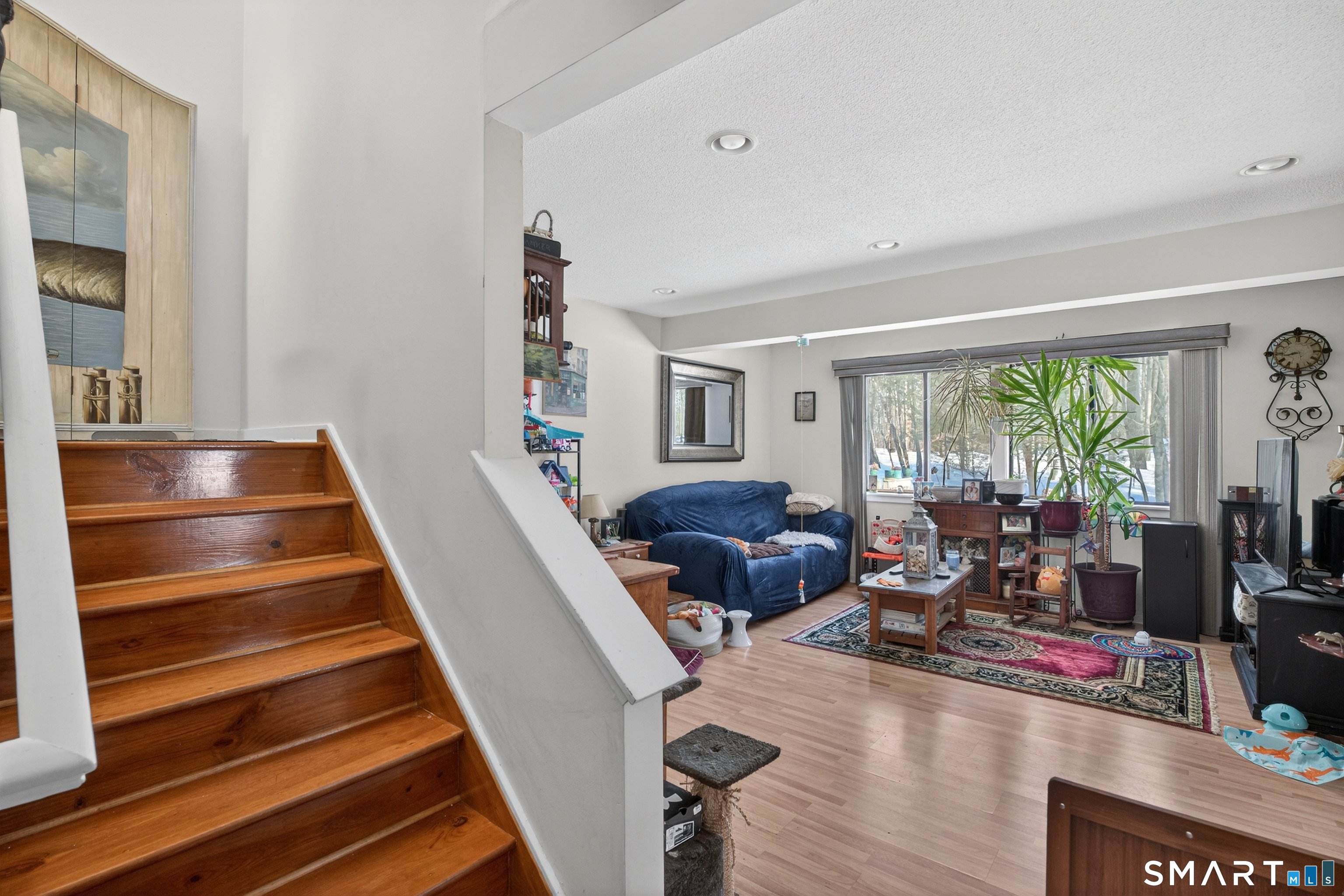 9 Upper Commons, Unit 9 Woodbury, CT 06798 - Photo 12 of 38 a living room with furniture and a wooden floor