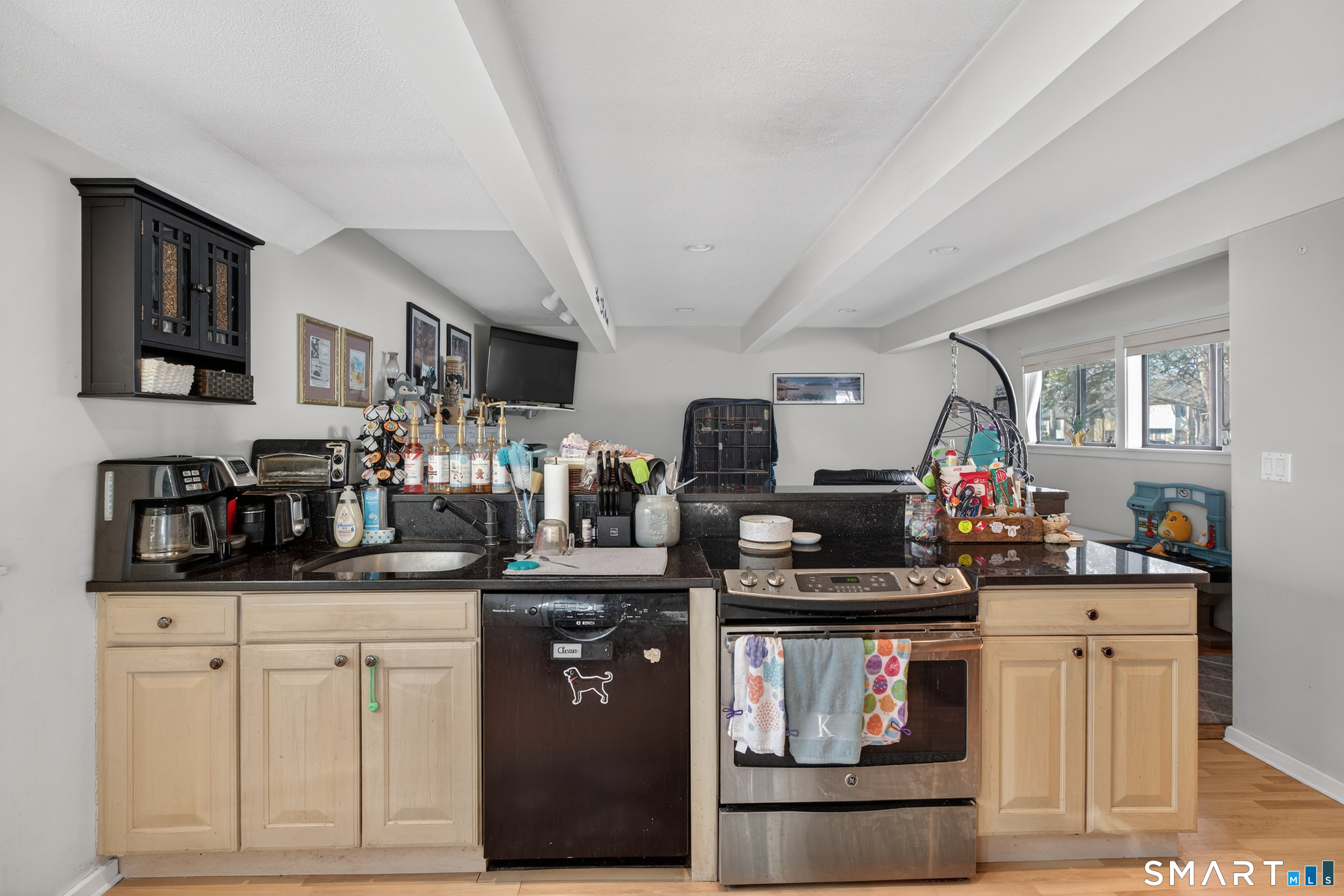 9 Upper Commons, Unit 9 Woodbury, CT 06798 - Photo 15 of 38 a kitchen with stainless steel appliances granite countertop a stove and cabinets