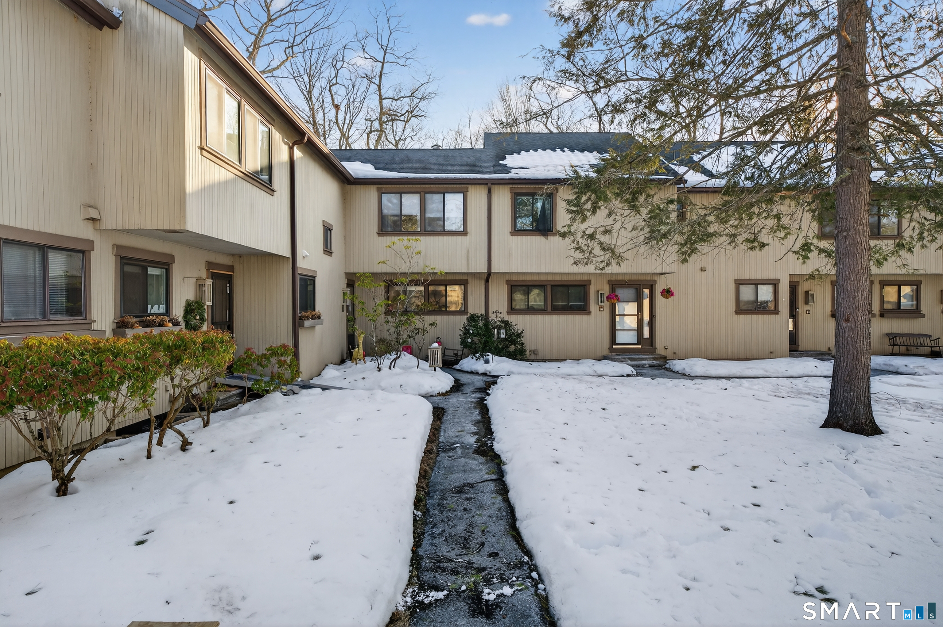 9 Upper Commons, Unit 9 Woodbury, CT 06798 - Photo 2 of 38 a view of a house with a snow on the road