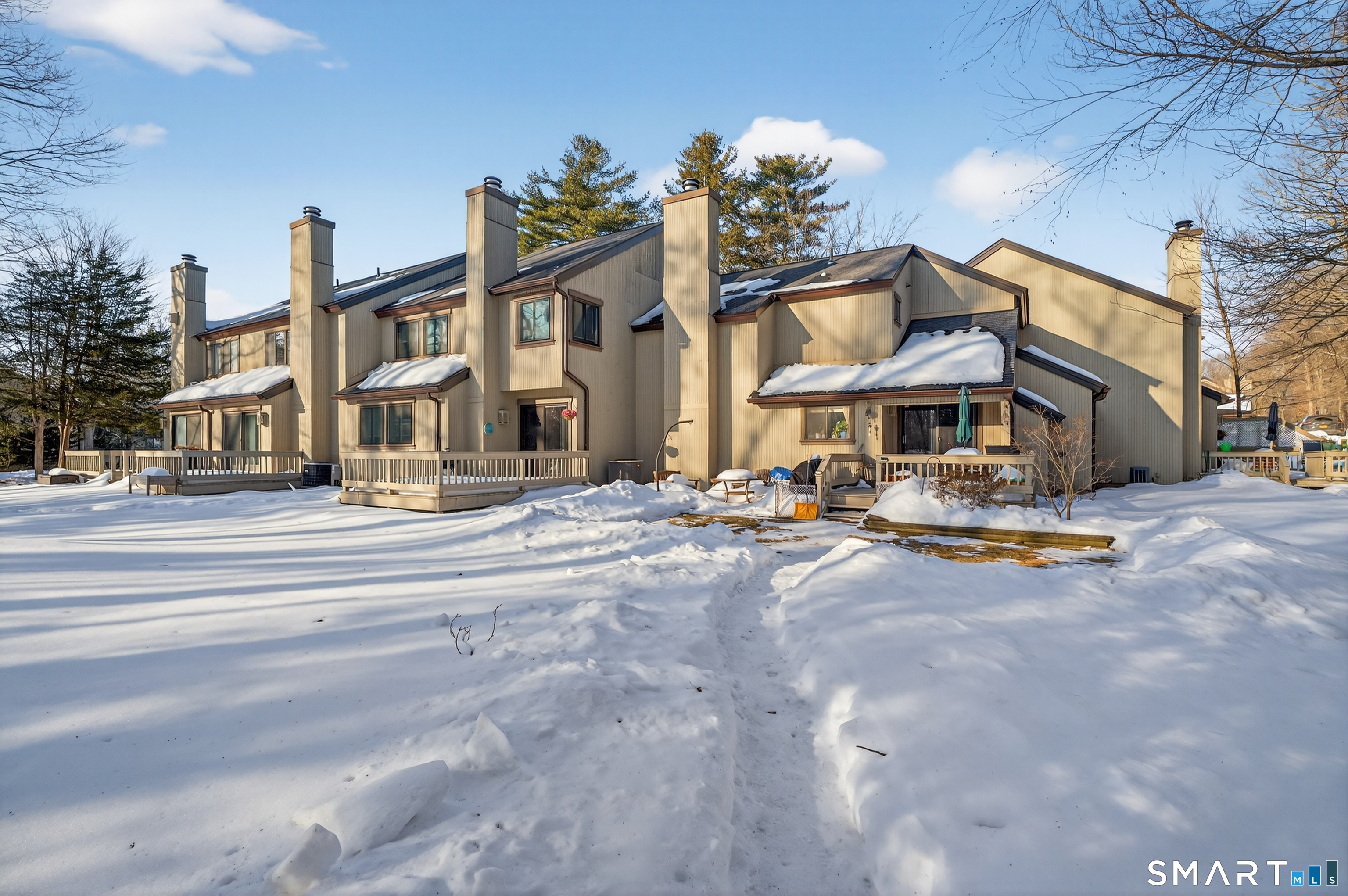9 Upper Commons, Unit 9 Woodbury, CT 06798 - Photo 2 of 38 a swimming pool with outdoor seating and yard