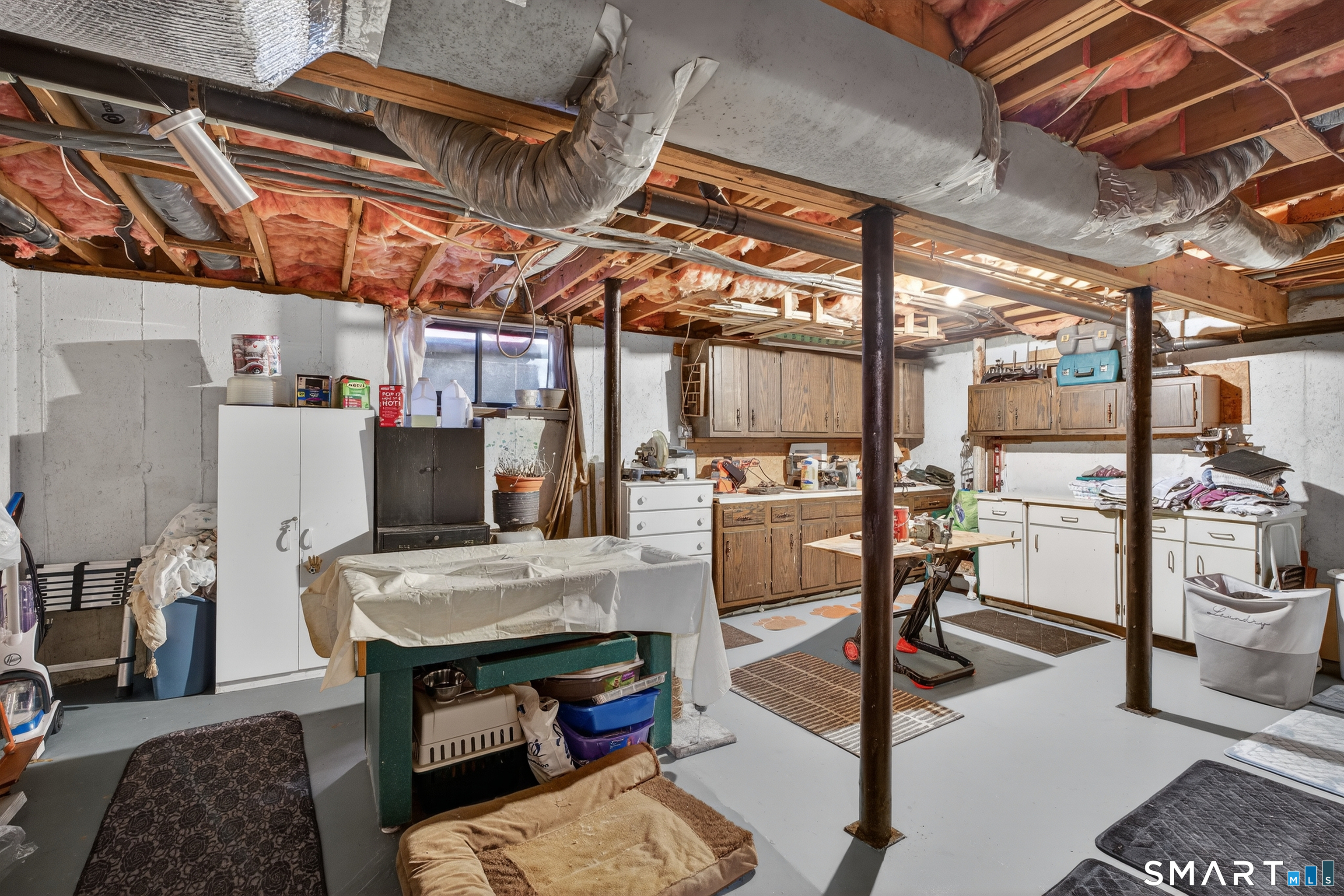 9 Upper Commons, Unit 9 Woodbury, CT 06798 - Photo 28 of 38 a view of a dining room with furniture a chandelier and wooden floor