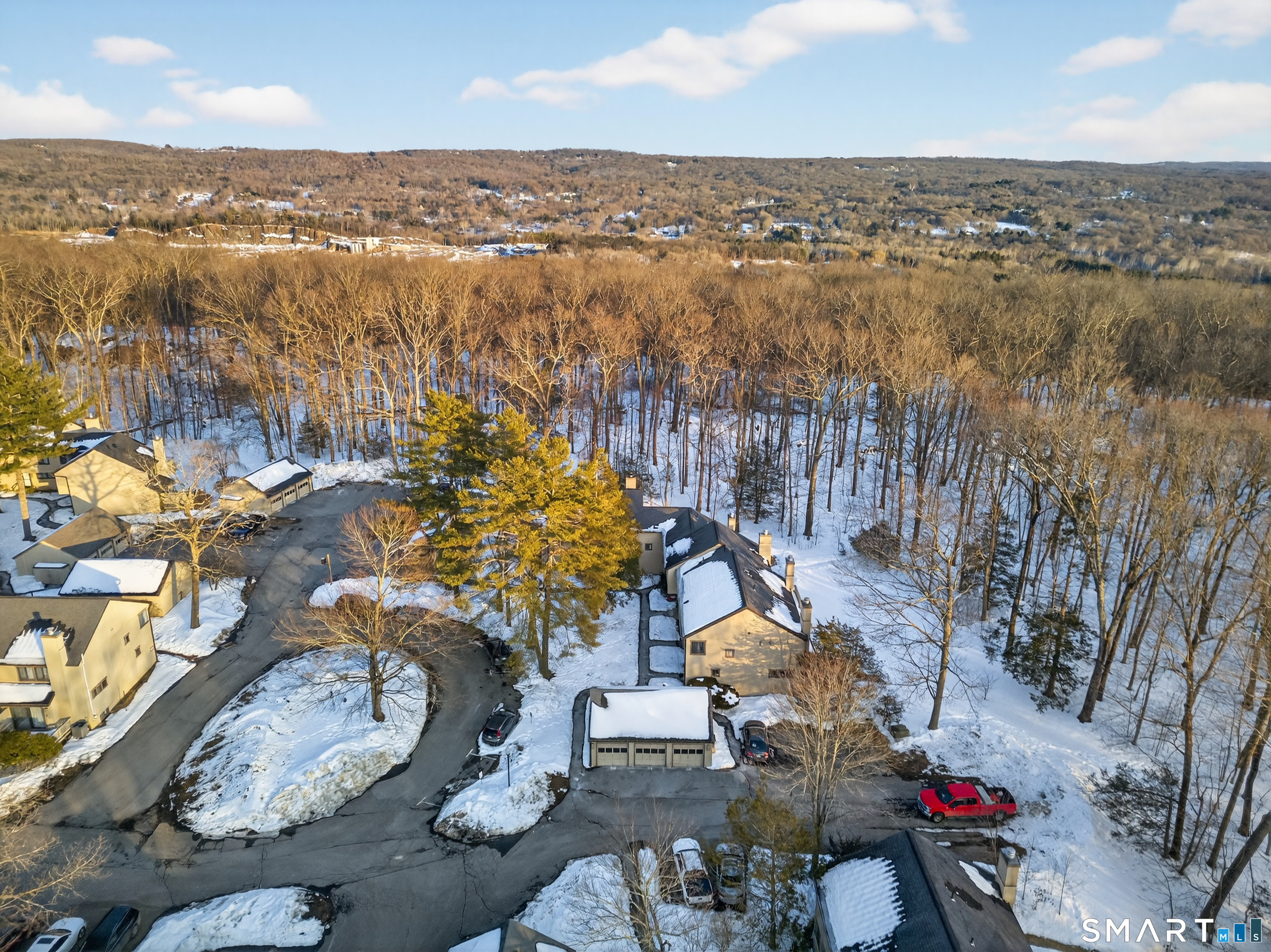 9 Upper Commons, Unit 9 Woodbury, CT 06798 - Photo 5 of 38 an aerial view of a city with lots of residential buildings