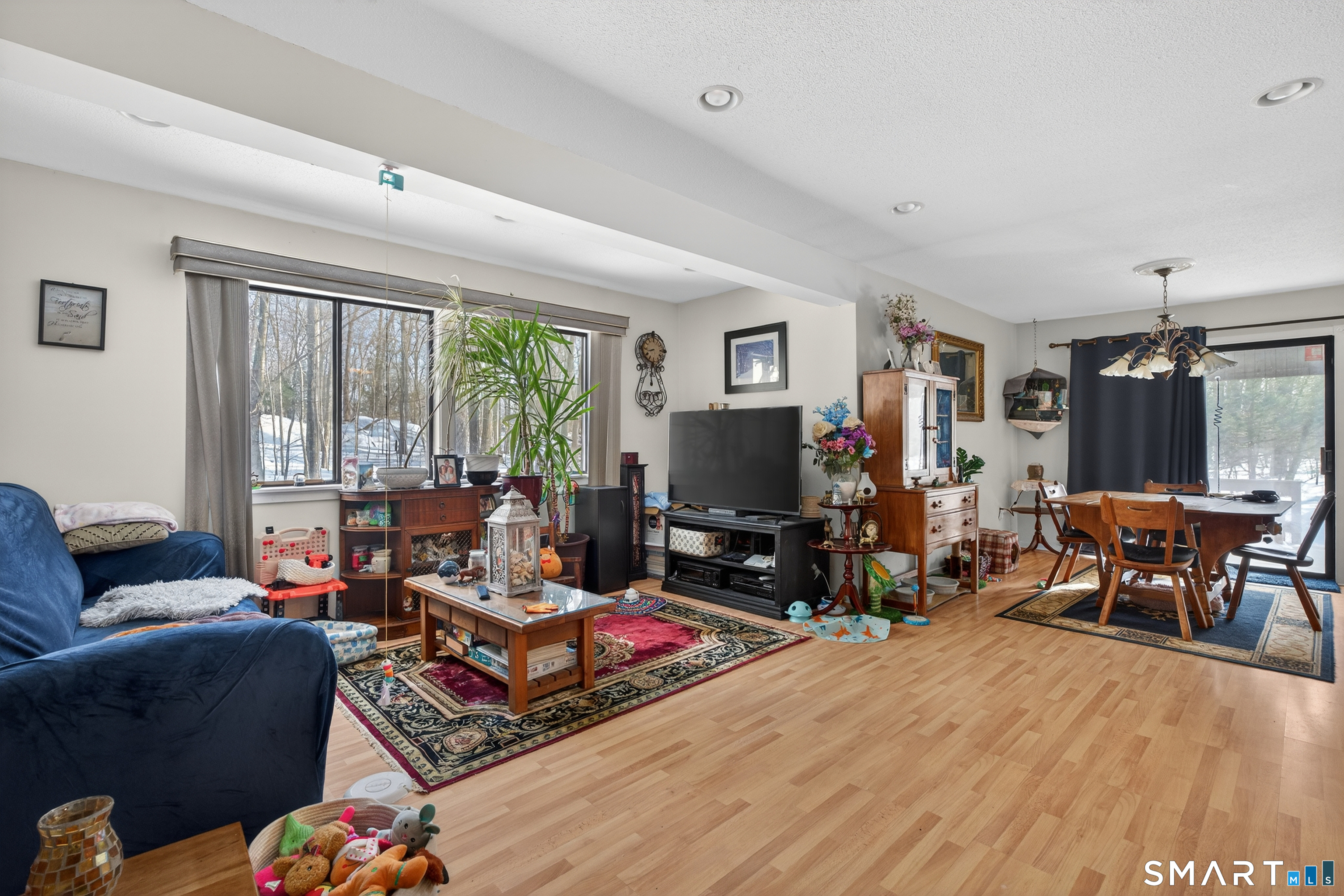 9 Upper Commons, Unit 9 Woodbury, CT 06798 - Photo 8 of 38 a living room with furniture a window and a flat screen tv