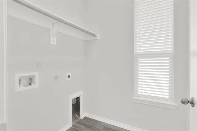 a view of a room with window and wooden floor