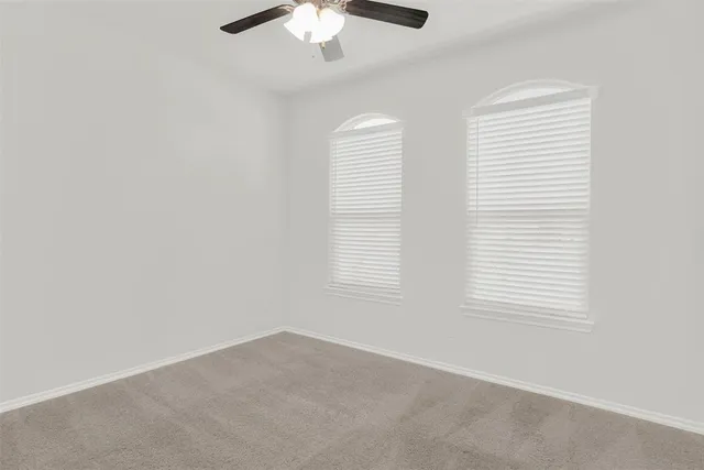 a bathroom with a double vanity sink and mirror