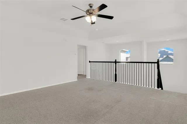a bathroom with a bathtub shower sink vanity and toilet