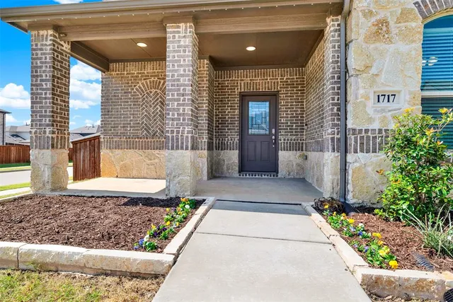 a view of a pathway besides a house