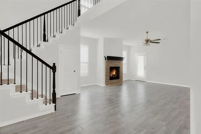 an aerial view of a house with pool table and chairs