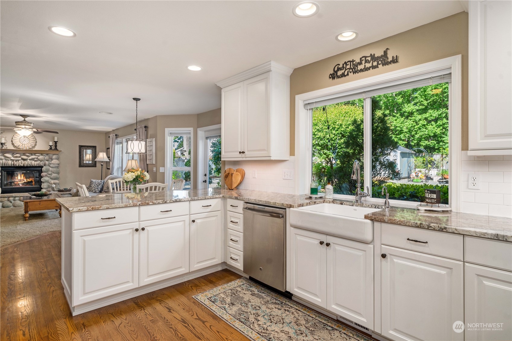 17811 87th Avenue East Puyallup, WA 98375 - Photo 13 of 37 a kitchen with a sink window and cabinets