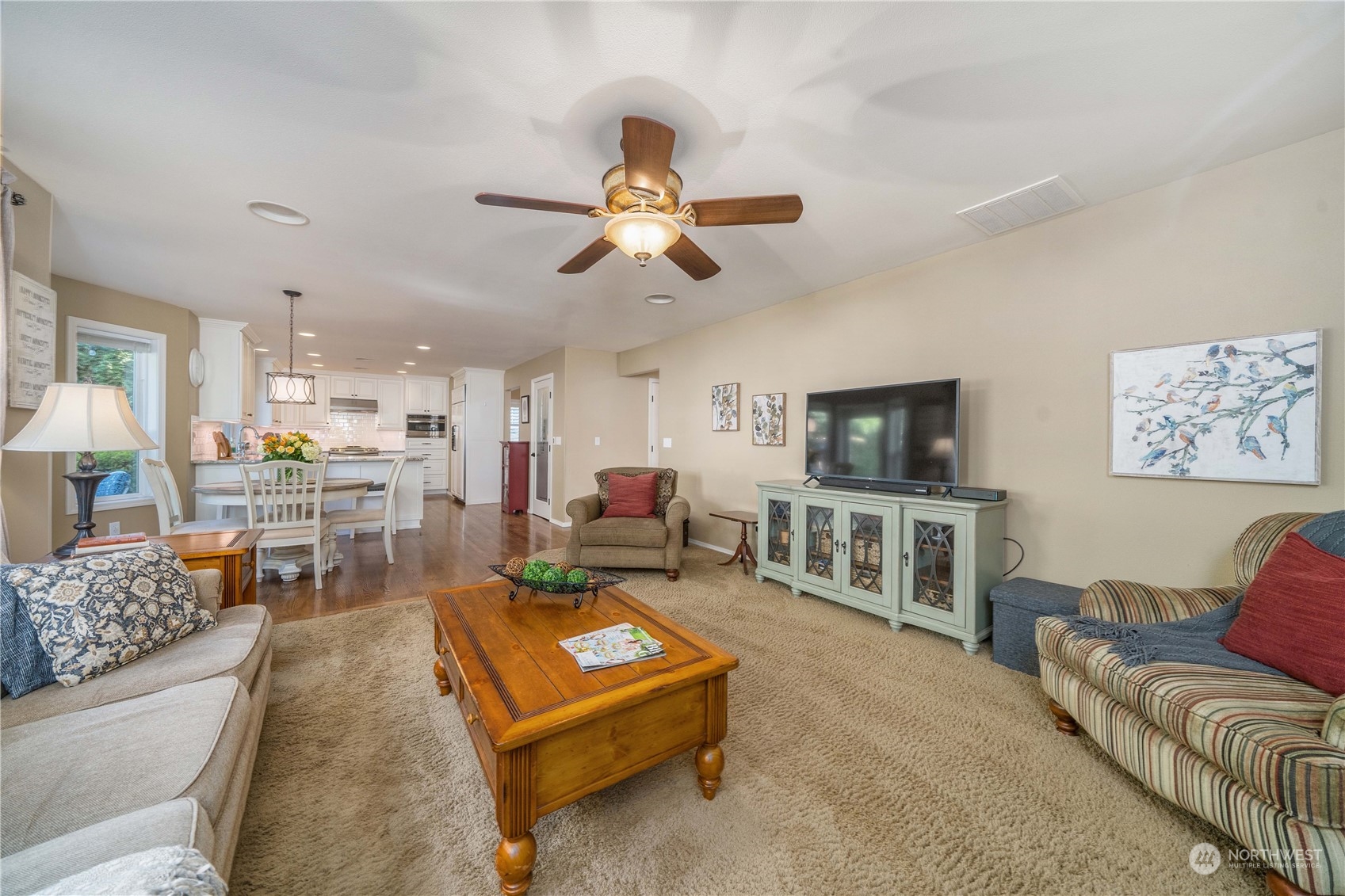17811 87th Avenue East Puyallup, WA 98375 - Photo 16 of 37 a living room with furniture and a flat screen tv