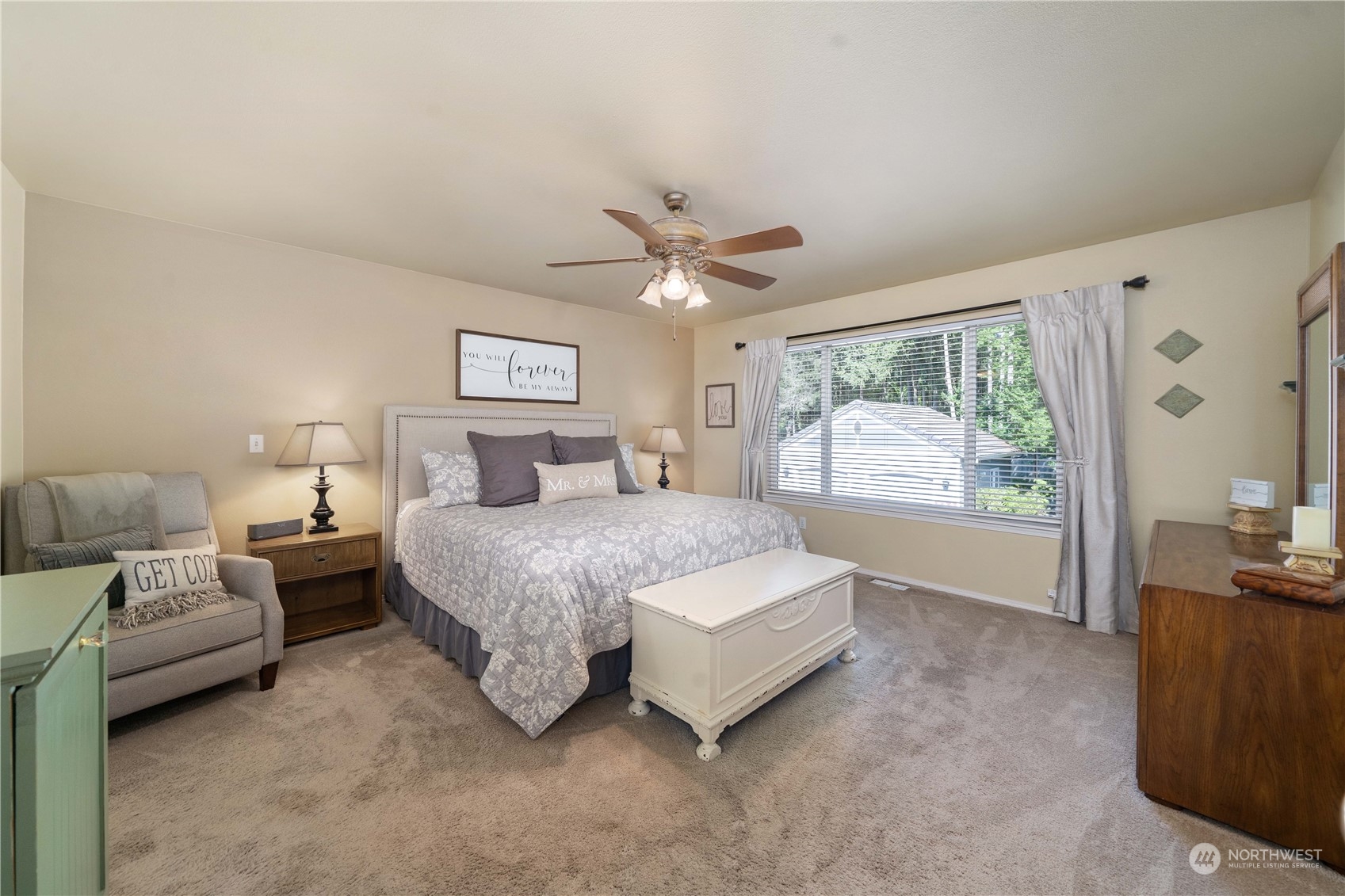 17811 87th Avenue East Puyallup, WA 98375 - Photo 17 of 37 a spacious bedroom with a bed and a large window