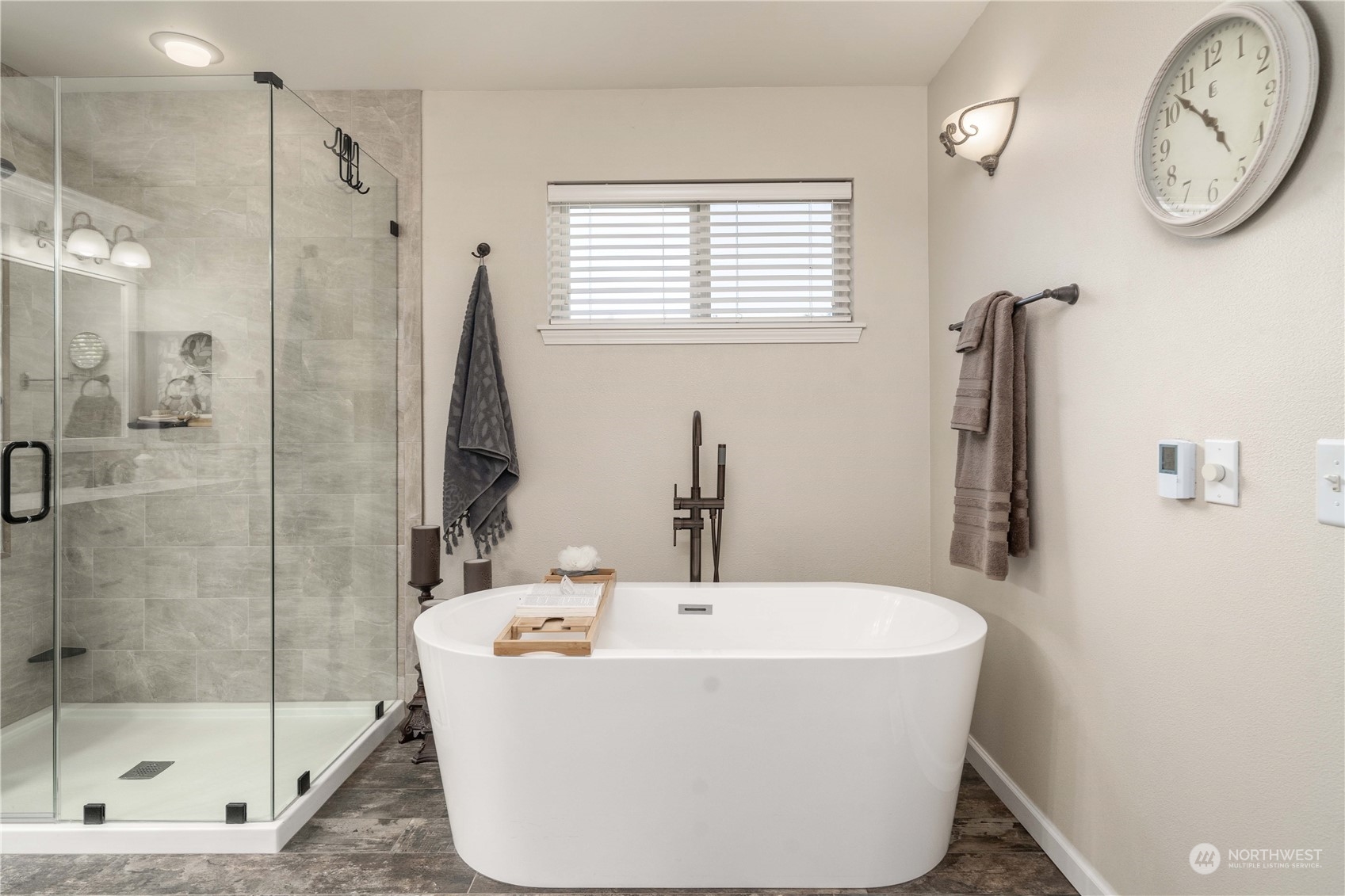 17811 87th Avenue East Puyallup, WA 98375 - Photo 19 of 37 a white bath tub sitting next to a bathroom