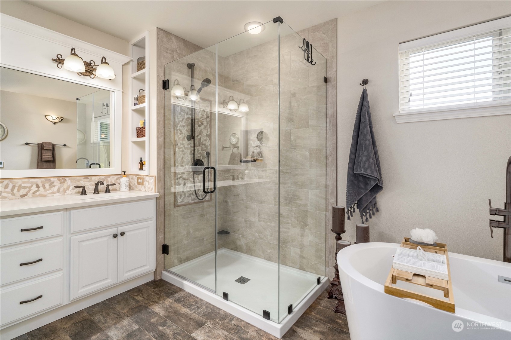17811 87th Avenue East Puyallup, WA 98375 - Photo 20 of 37 a bathroom with a bathtub shower sink vanity and toilet
