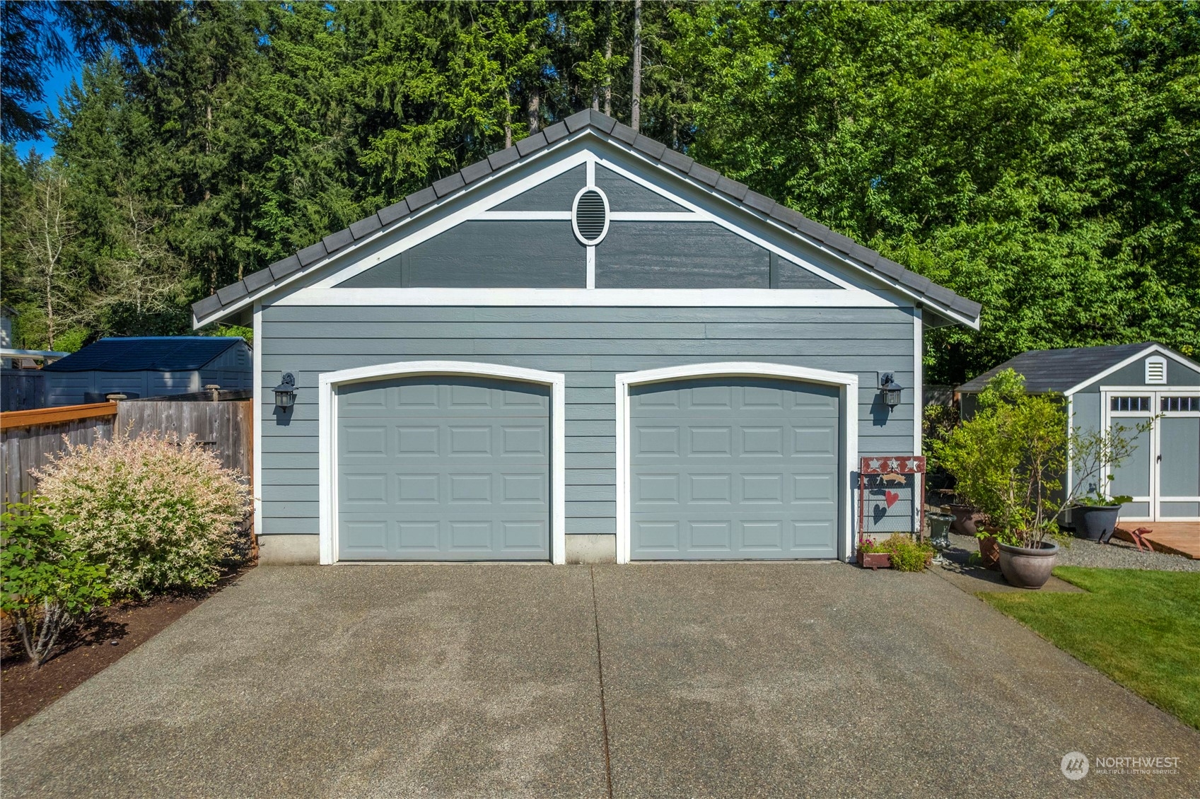 17811 87th Avenue East Puyallup, WA 98375 - Photo 2 of 37 a front view of a house with a yard and garage