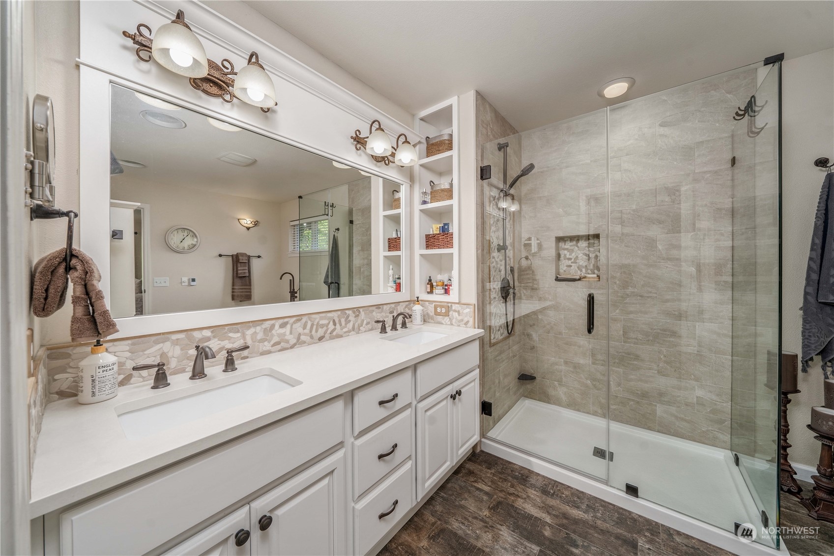 17811 87th Avenue East Puyallup, WA 98375 - Photo 21 of 37 a bathroom with a double vanity sink mirror double shower and a bathtub