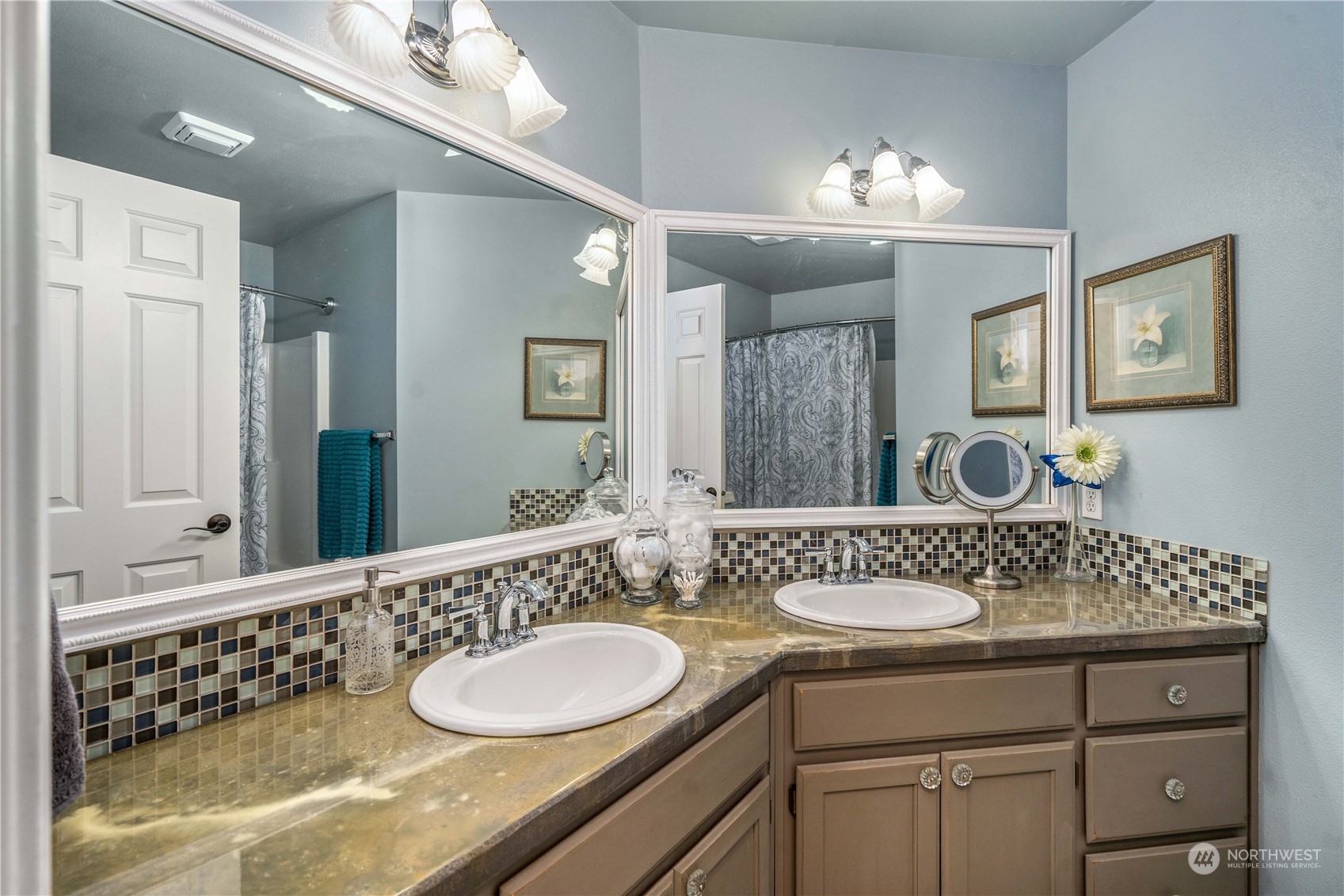 17811 87th Avenue East Puyallup, WA 98375 - Photo 23 of 37 a bathroom with a sink double vanity and a mirror