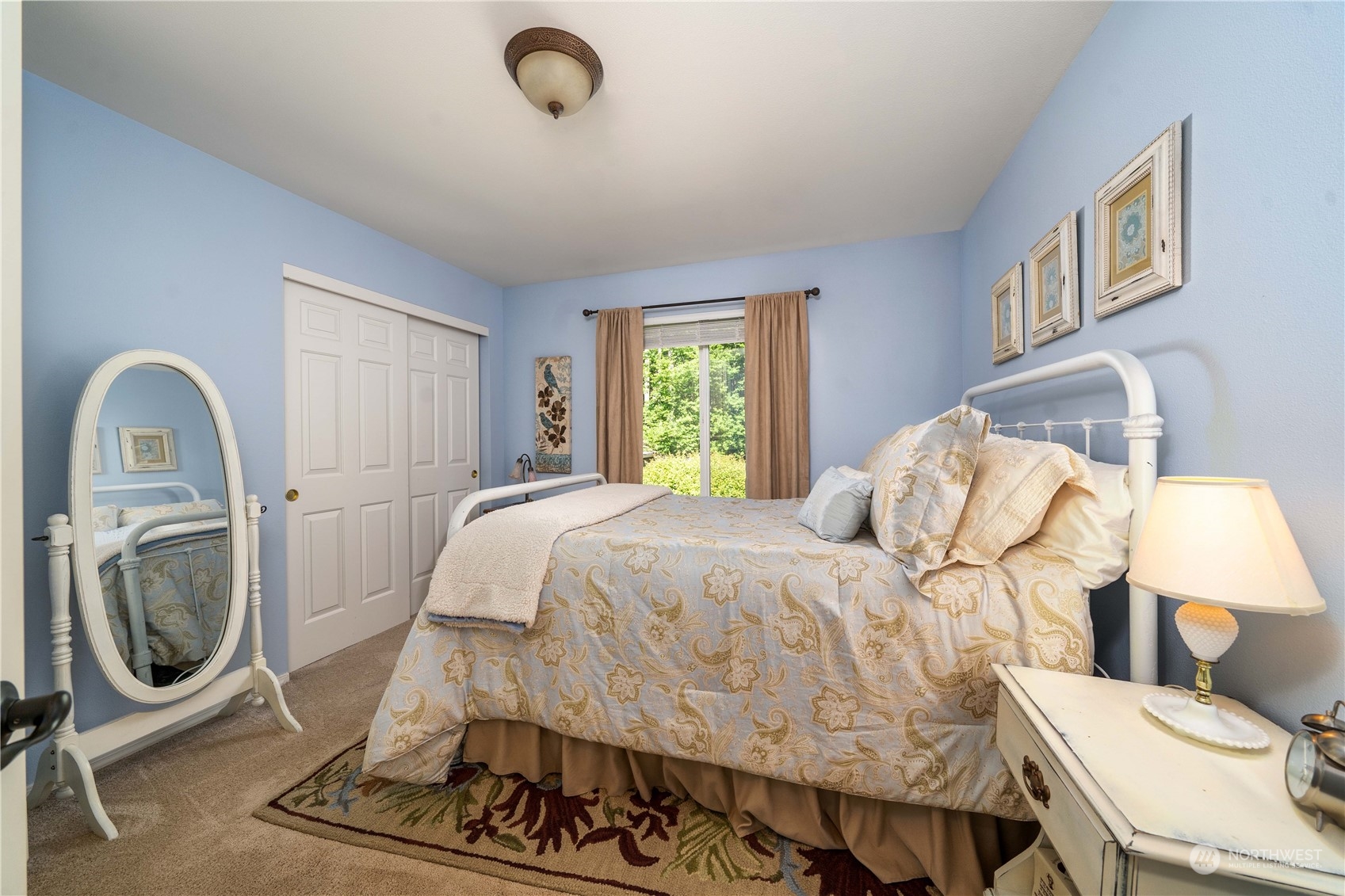 17811 87th Avenue East Puyallup, WA 98375 - Photo 24 of 37 a bedroom with a bed and glass window