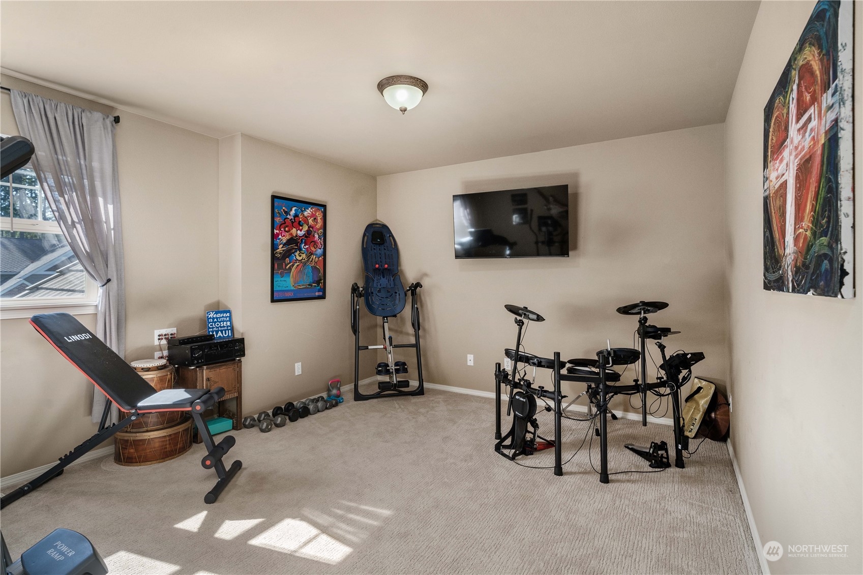 17811 87th Avenue East Puyallup, WA 98375 - Photo 25 of 37 a room with furniture and a flat screen tv
