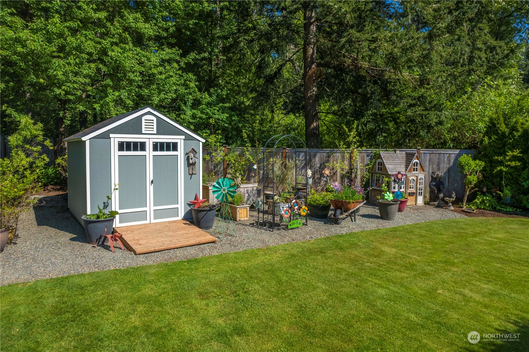 17811 87th Avenue East Puyallup, WA 98375 - Photo 27 of 37 a view of a house with backyard sitting area and garden
