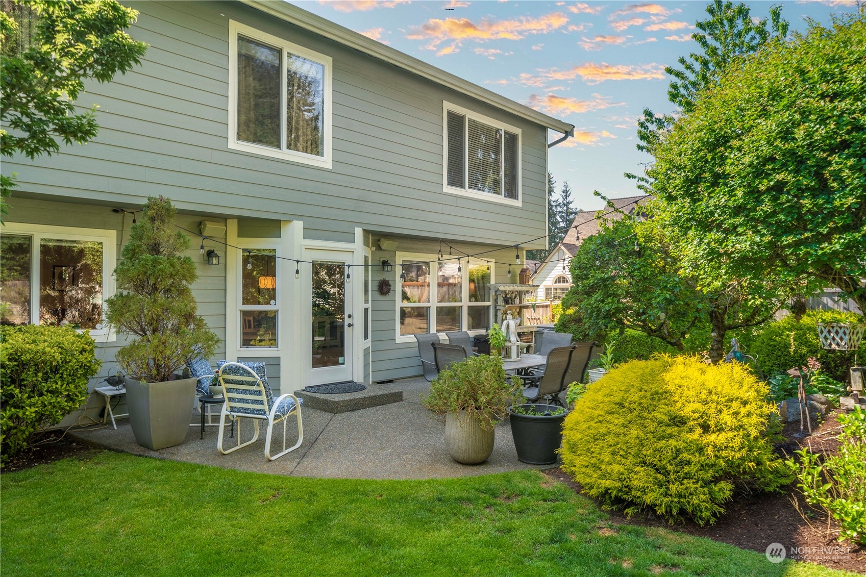 17811 87th Avenue East Puyallup, WA 98375 - Photo 30 of 37 a view of a chair and table in backyard of the house