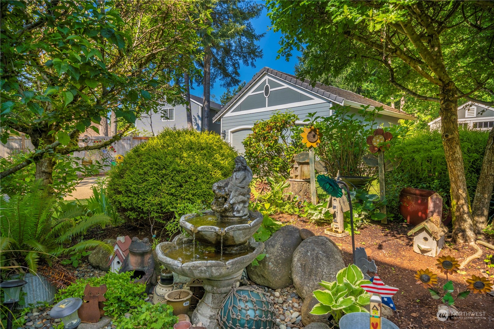 17811 87th Avenue East Puyallup, WA 98375 - Photo 32 of 37 a backyard of a house with a yard and outdoor seating
