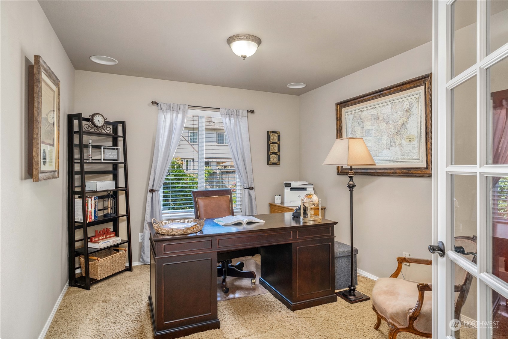 17811 87th Avenue East Puyallup, WA 98375 - Photo 8 of 37 a view of a workspace with furniture and a window
