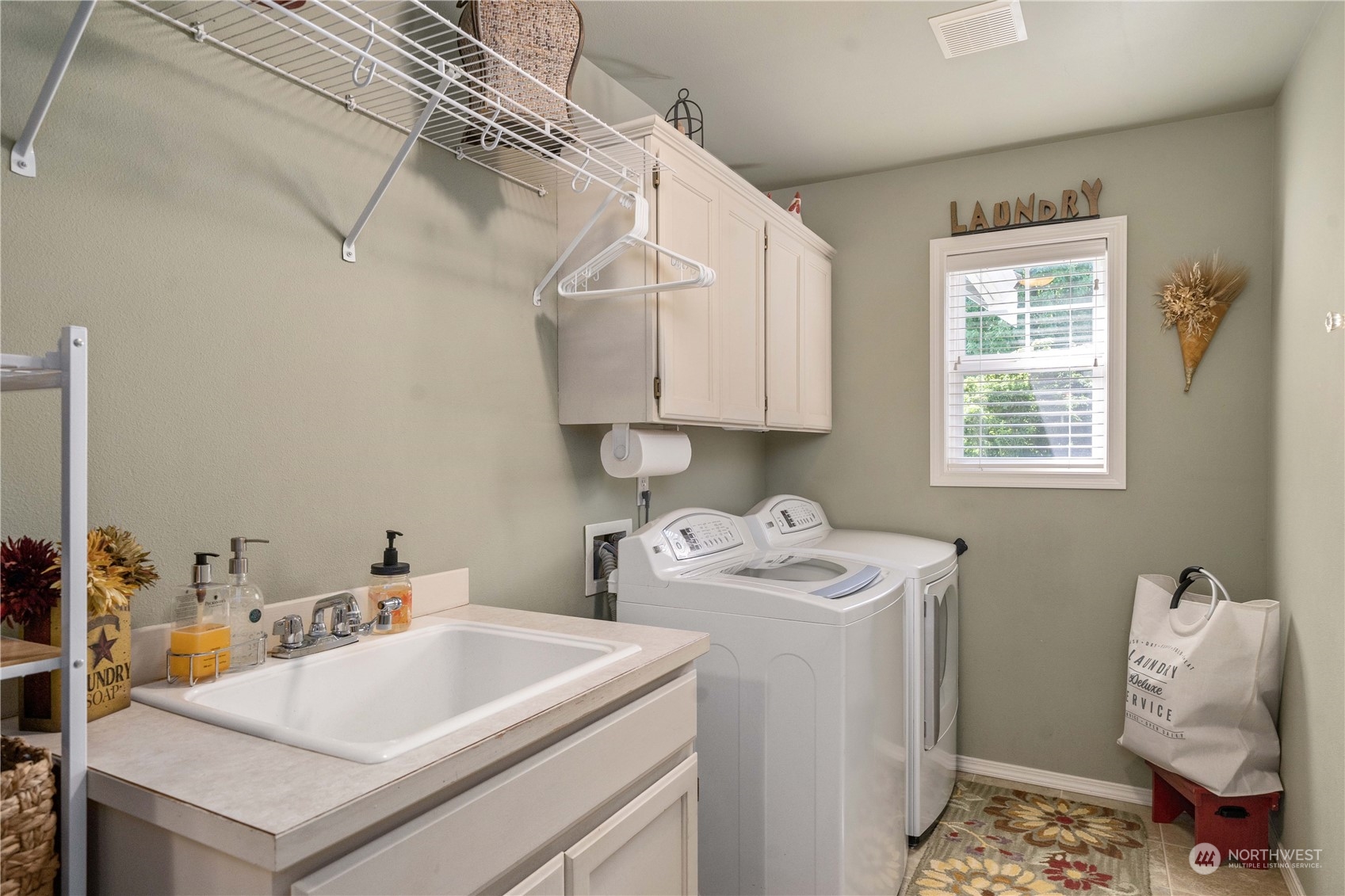 17811 87th Avenue East Puyallup, WA 98375 - Photo 9 of 37 a utility room with dryer and washer