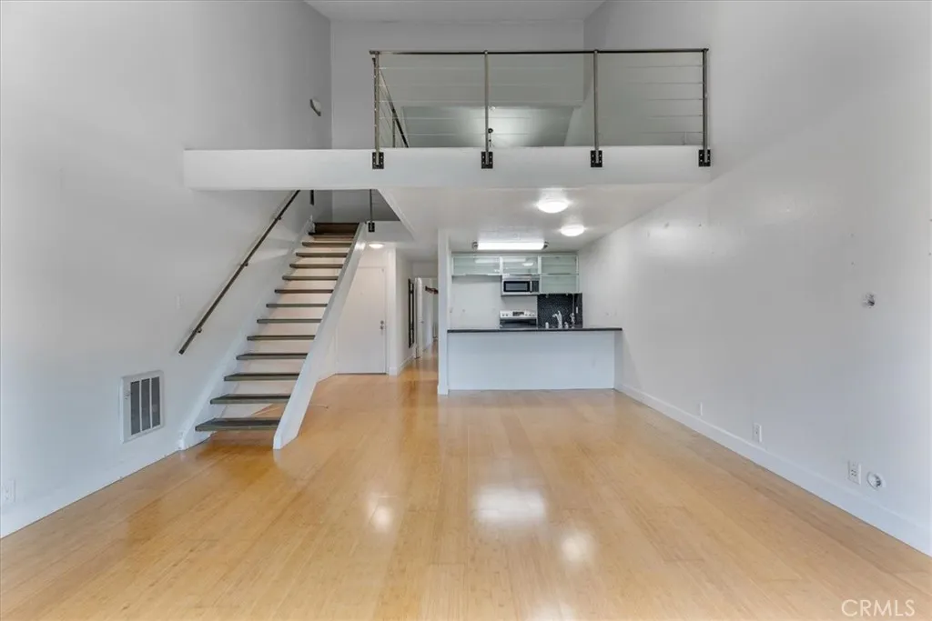7890 East Spring Street, Unit 18F Long Beach, CA 90802 - Photo 1 of 31 a view of a room with gym equipment