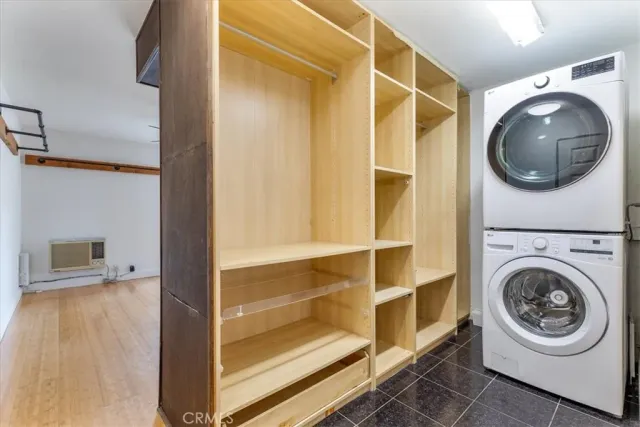 a view of a hallway with washer and dryer