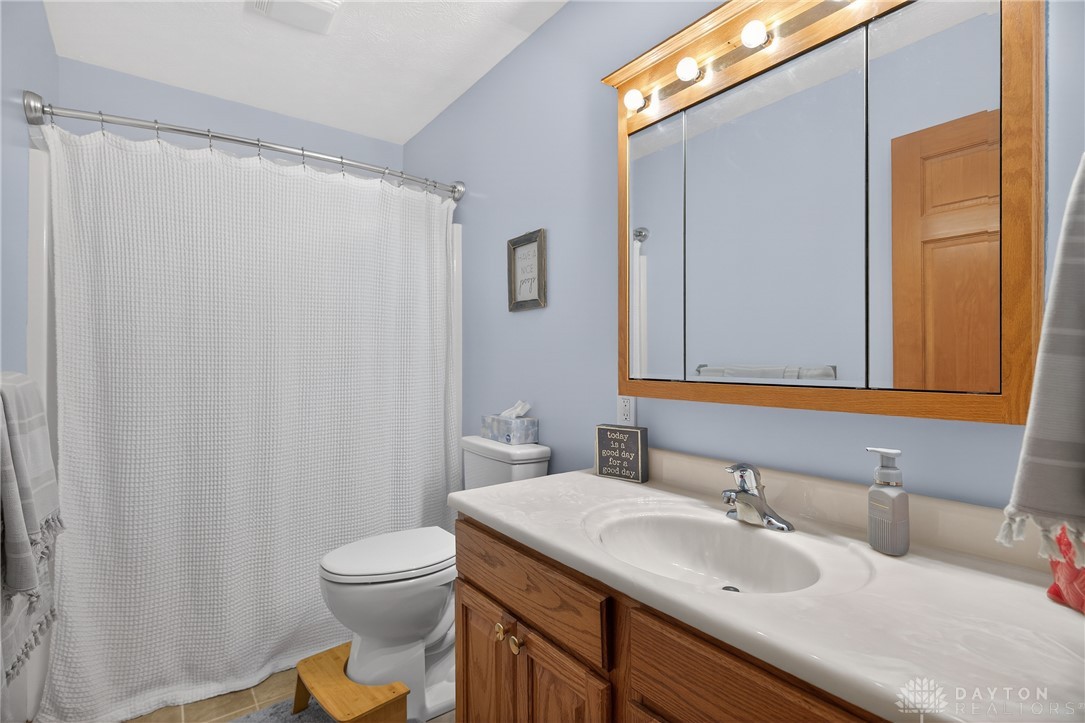 5264 Frazier-Guy Road Sidney, OH 45365 - Photo 29 of 51 This bathroom features a sleek vanity, convenient medicine cabinet, and functional shower.