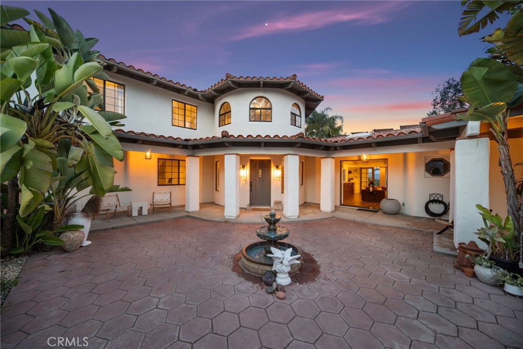 a front view of a house with patio