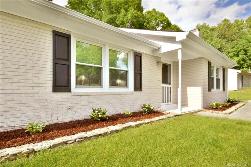 6426 Round Hill Road Charlotte, NC 28211 - Photo 2 of 23 a front view of a house with a yard