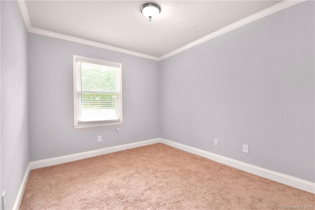 6426 Round Hill Road Charlotte, NC 28211 - Photo 16 of 23 an empty room with a window