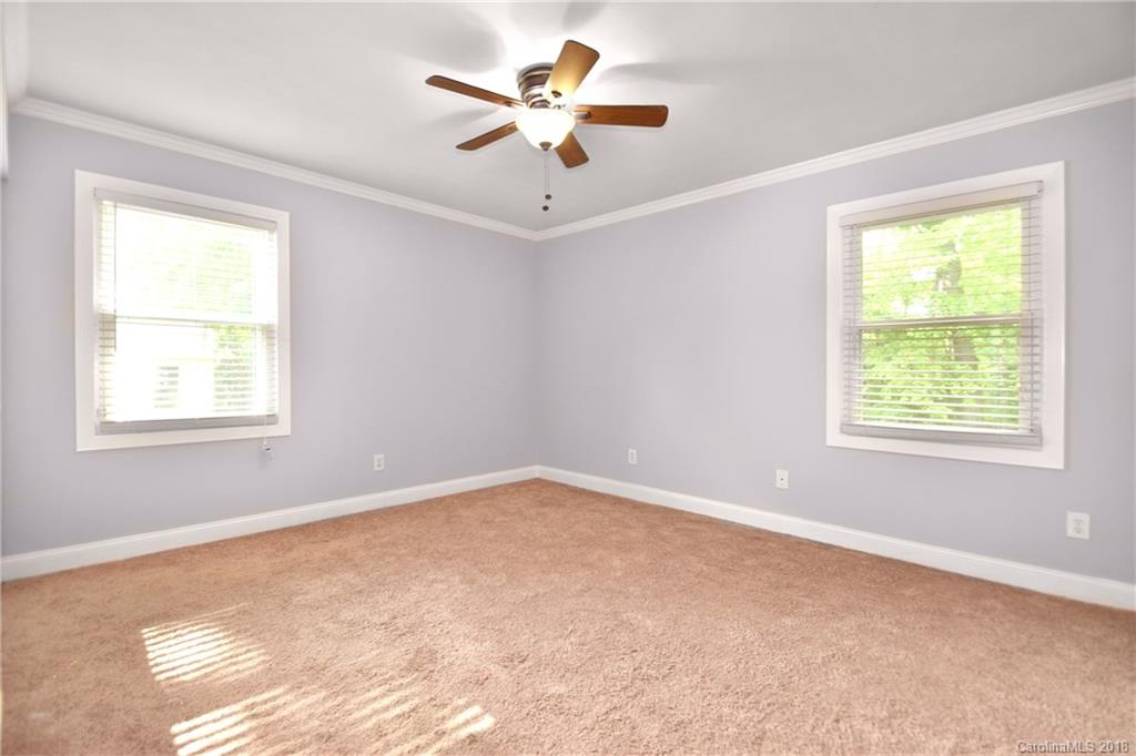 6426 Round Hill Road Charlotte, NC 28211 - Photo 17 of 23 a view of an empty room with a window