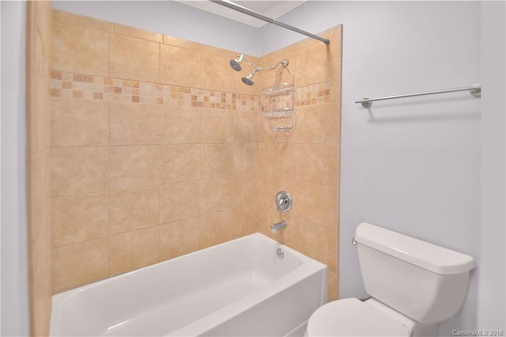 6426 Round Hill Road Charlotte, NC 28211 - Photo 18 of 23 a bathroom with a sink and a toilet